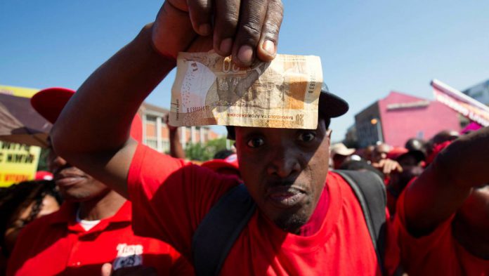 Union members protest the proposed national minimum wage during a march in Durban